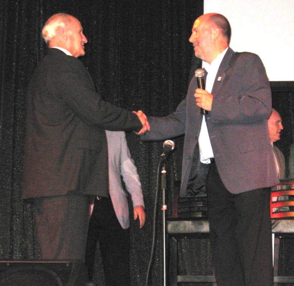 Brian (left) presented with his commemorative medal by CCFPA's Jim Bromn in 2009
